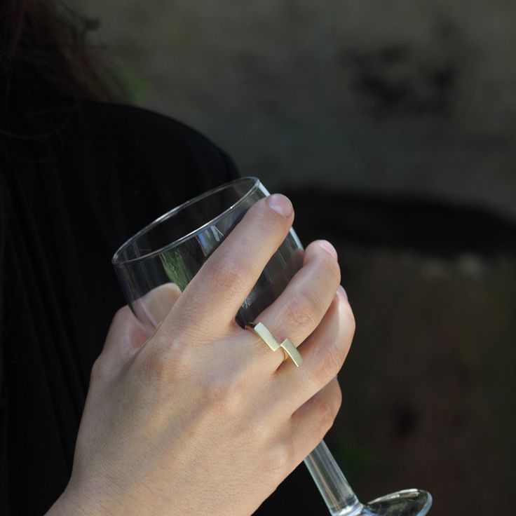 This is a unique geometric 14k solid gold ring. The ring is handmade of yellow 14k solid gold, and its finish is smooth and shiny. The rectangles have a delicate scratched finish. The meeting point of the rectangles, at one corner, reminds me of a kiss. A minimalist, modern, and eye catching ring. Ring's size is 6 1/4 Rectangle's width is approx. 4 mm = 0.15 inch each Rectangle's length is approx. 11.5 mm = 0.45 inch each * The ring will be packed in a gift box ready to give as a gift, and shipp Minimalist 14k Yellow Gold Rings, Modern Gold Stackable Rings With Tension Setting, Modern Gold Signet Ring With Tension Setting, Minimalist Signet Ring With Tension Setting For Formal Occasions, Elegant Recycled Gold Open Signet Ring, Minimalist Formal Signet Ring With Tension Setting, Formal Minimalist Signet Ring With Tension Setting, Minimalist White Gold Midi Rings For Formal Occasions, White Gold Minimalist Midi Rings For Formal Occasions