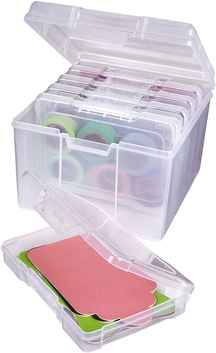 a plastic storage box filled with lots of crafting supplies