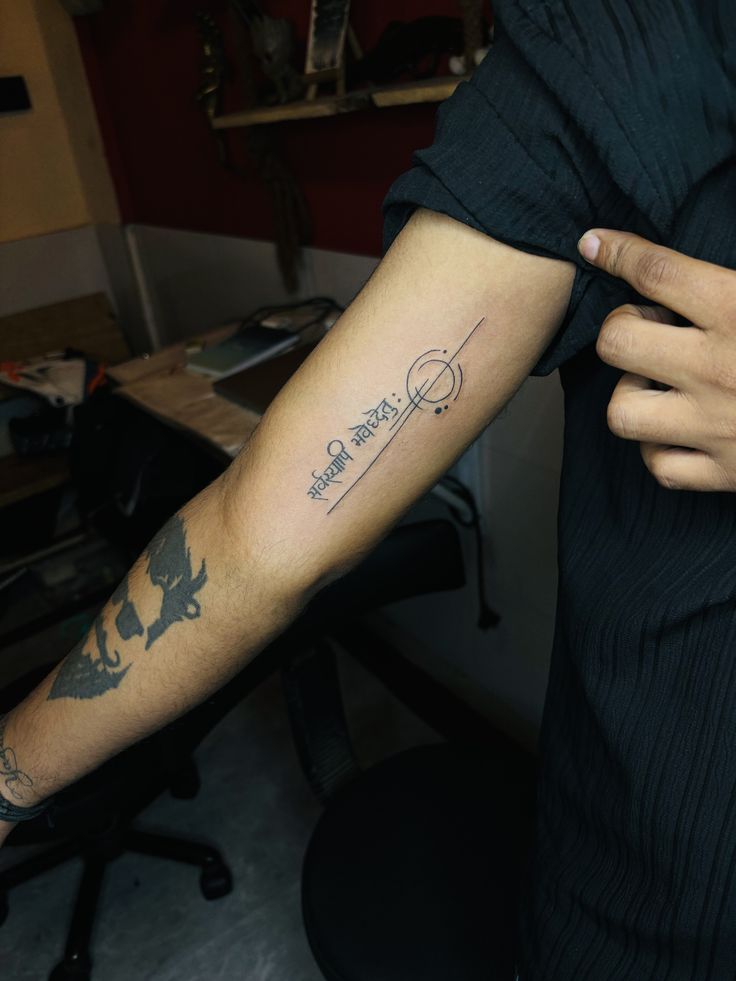 a person with a tattoo on their arm