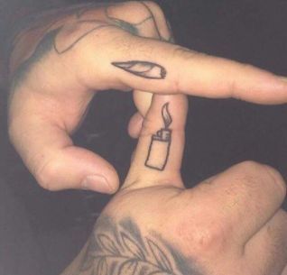 two people with tattoos on their fingers making the peace sign and holding a lighter tattoo