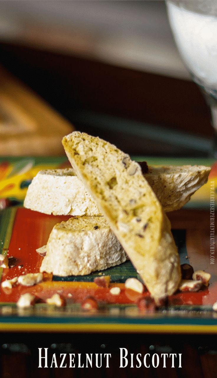 two pieces of bread sitting on top of a colorful plate