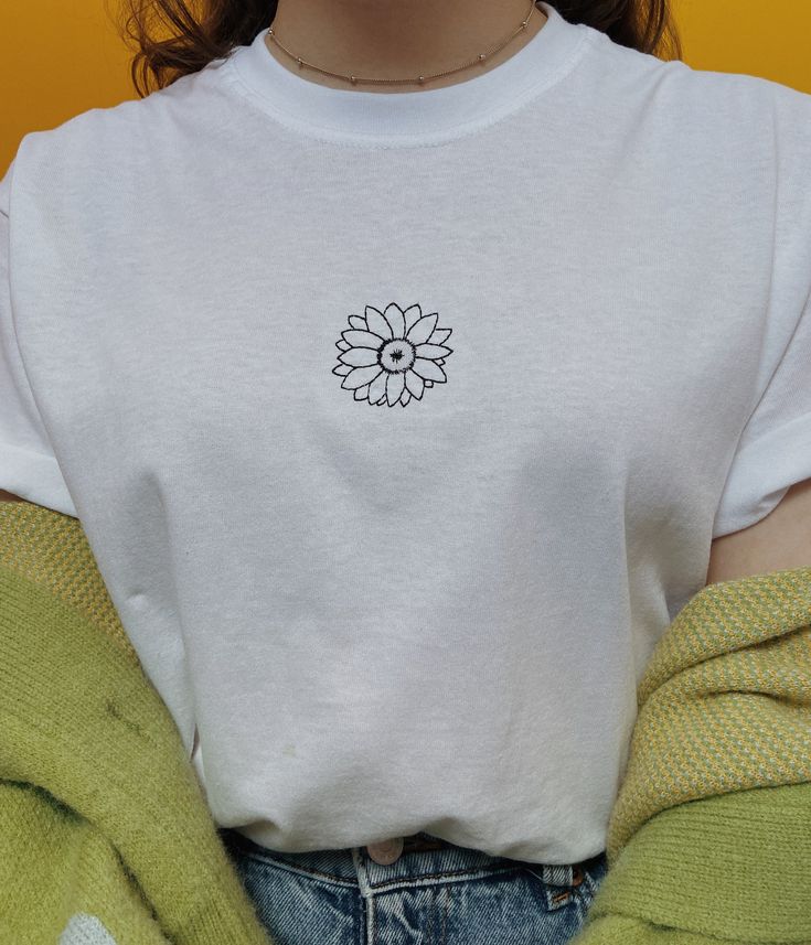 🌻 Embroidered sunflower design on a white 100% cotton t-shirt, backed with stabiliser to keep the stitches nice and neat. Tees are unisex so have a slightly oversized look on women, go down a size for a slimmer fit. Fit is truer to size for men. US letter stands for unisex letter. Model wears a medium. US letter stands for unisex letter. Message me if you need a size I don't have in stock. Wash on 30 and make sure to iron inside out to keep the embroidery from getting damaged. All orders will b Embroidery Tshirt, Sunflower Design, Men Model, Embroidered Tshirt, Wearing Clothes, Personalized Card, Look On, Cotton T Shirt, Hand Embroidered