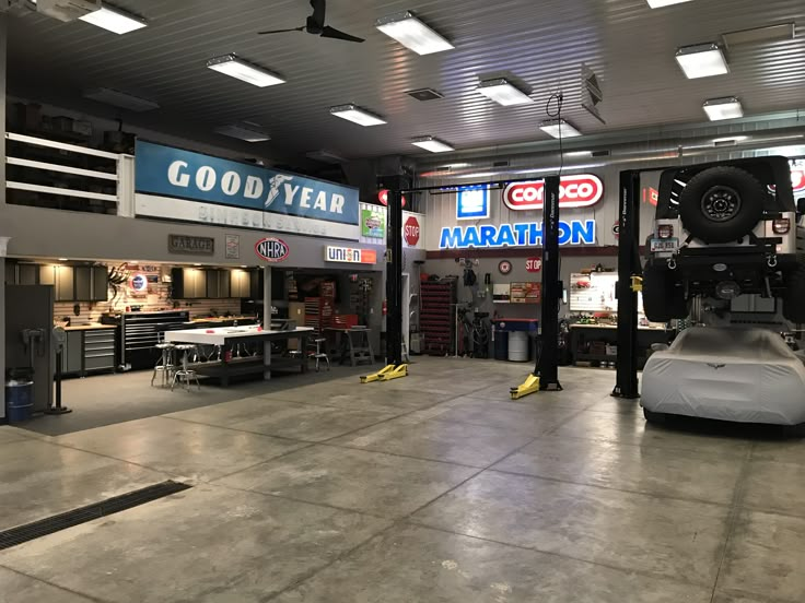 the inside of a garage with cars parked in it