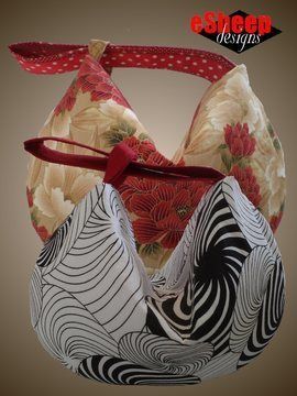 an ornament made out of fabric with red ribbon