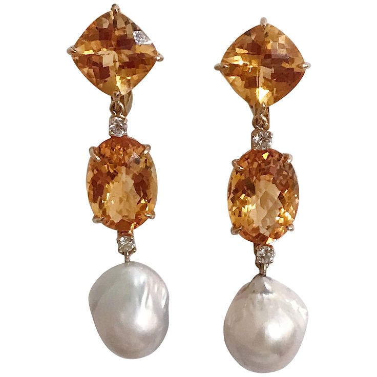 18kt Yellow Gold Elegant Three Stone Drop Earrings with two Citrine and Baroque Pearl and Diamonds Faceted Cushion, Oval, and then Baroque Pearl finished with four diamonds ~0.60cts. These earrings measure 2 1/2" in length and 1/2" wide. The earrings can be made for Clip Earring or Pierced Earrings. They can also be custom made with any color stone combination. Please contact me with any inquiries you may have. Best, Christina Stone Drop Earrings, Pearl Jewelry Design, Gold Link Bracelet, Pink Topaz, Drop Earring, Accessories Jewelry Earrings, Baroque Pearls, Three Stone, Estate Jewelry