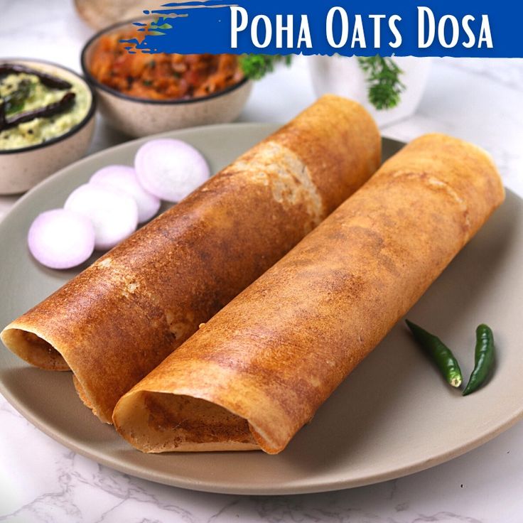 some food is laying out on a plate with the words poha oats dosa