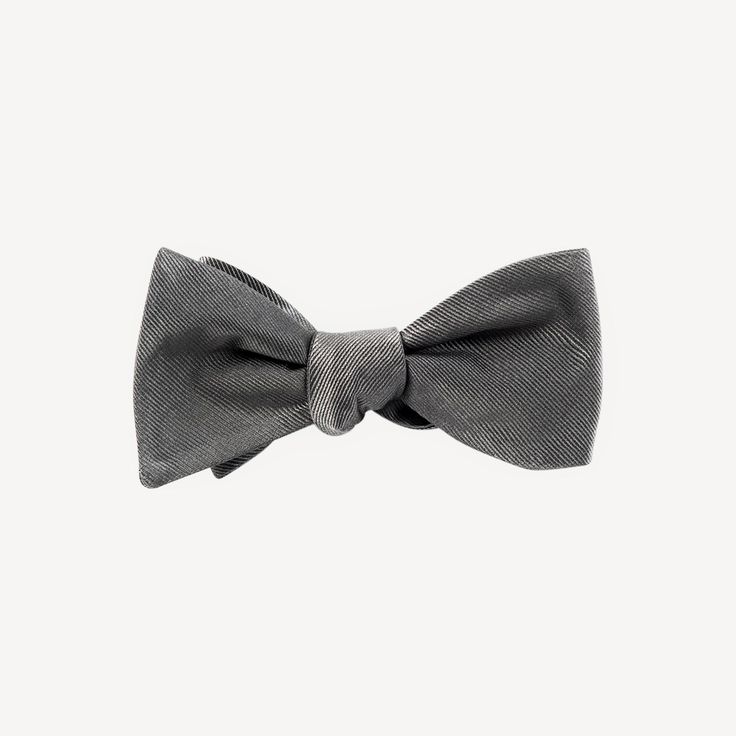 We've partnered with The Tie Bar to bring you this classic assortment of hand tied bowties in a variety of colors. Size is 2.5 in. wide x 58 in. long. Material: Handmade of 100% Silk Fabric Care: Imported, Dry-clean Only Detail: Hand Tied