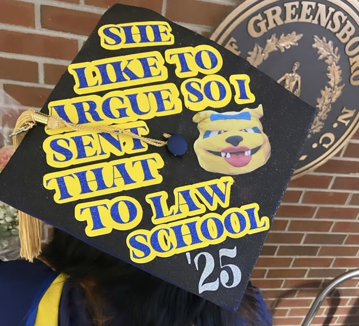 a person wearing a graduation cap with the words she like to agree so that to law school