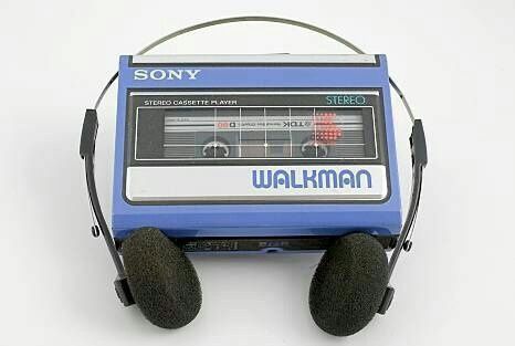 an old fashioned walkman with headphones on it's ears and ear muffs