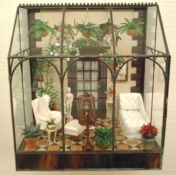 a doll house with furniture and plants in it