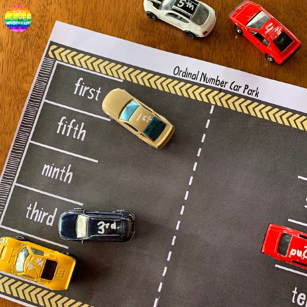 cars and trucks are parked on the road in front of a car park sign that says, original number car park