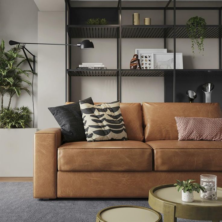 a living room filled with furniture and plants