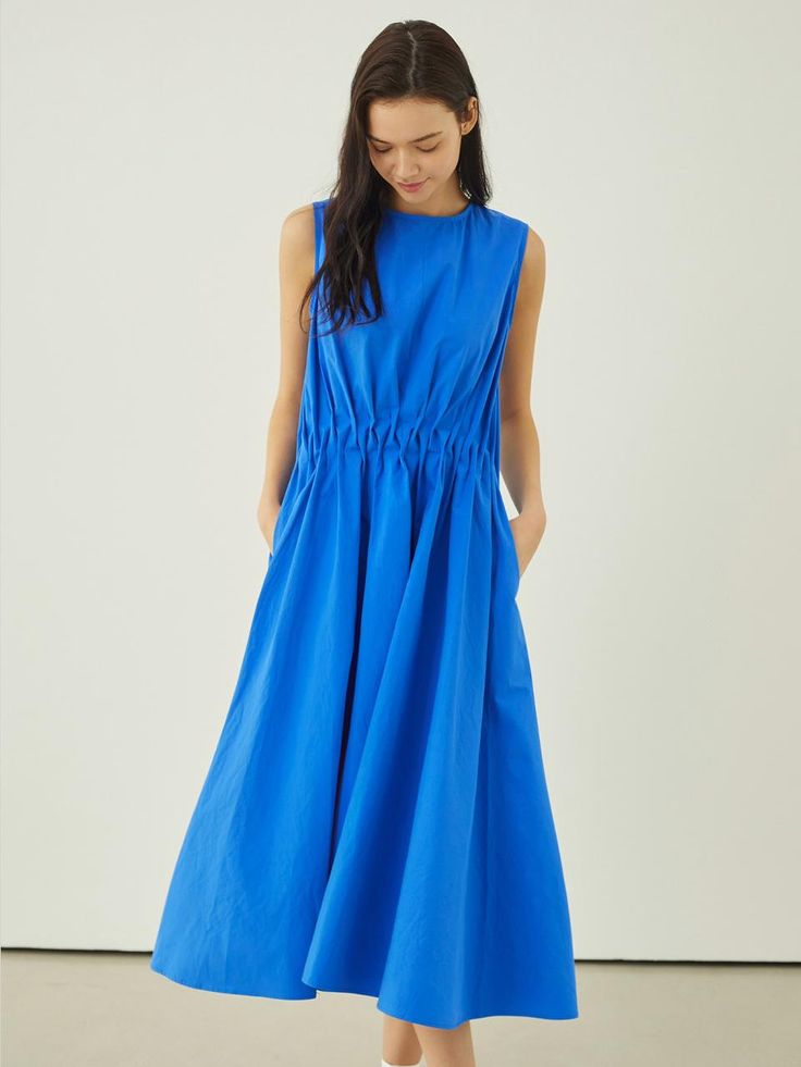 This lovely dress features voluminous, drapery silhouette in maxi length. It is accentuated with unique shirred details at waist.  - Intended for a loose fit- Lightweight cotton fabric- Airy, crisp texture- Casual side pockets and back zip fastenings- Cute and feminine feel Billowy Ruched Maxi Dress, Cotton Dress With Pleated Waist And Voluminous Skirt, Spring Midi Dress With Pleated Waist And Voluminous Skirt, Ruched Midi Dress With Voluminous Skirt, Spring Dress With Voluminous Skirt And Gathered Waist, Spring Draped Maxi Dress With Ruched Bodice, Spring Ruched Maxi Dress With Voluminous Skirt, Chic Dress With Gathered Waist And Voluminous Skirt, Spring Dresses With Pleated Waist And Draped Shape