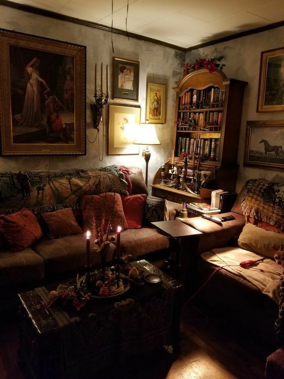 a living room filled with furniture and paintings