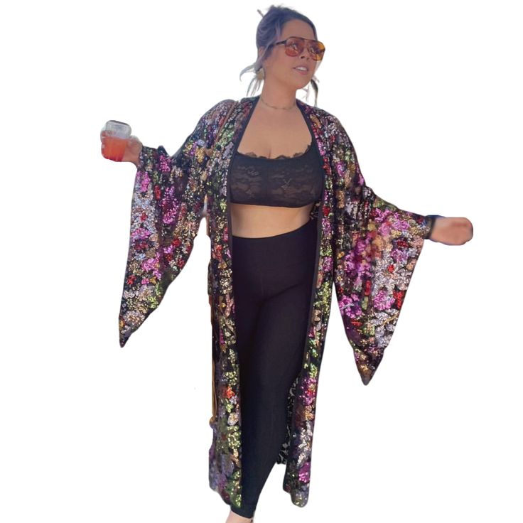 This kimono is gorgeous! Sheer black mesh covered in a multi-colored floral motif! The shape is dramatic yet easy to wear. When the sun or bright light shines on it colors are reflected all around. Truly mesmerizing! When light passes through it a beautiful lace pattern casts its shadow around you! Something so special and unique just like you. Fitted Floral Print Kimono, Spring Floral Print Fitted Kimono, Fitted Floral Print Kimono For Spring, Fitted Floral Kimono For Festival, Multicolor Floral Print Kimono One Size, One Size Multicolor Floral Print Kimono, Fitted Kimono For Spring Party, Black Summer Kimono With Kimono Sleeves, Spring Party Kimono With Open Front