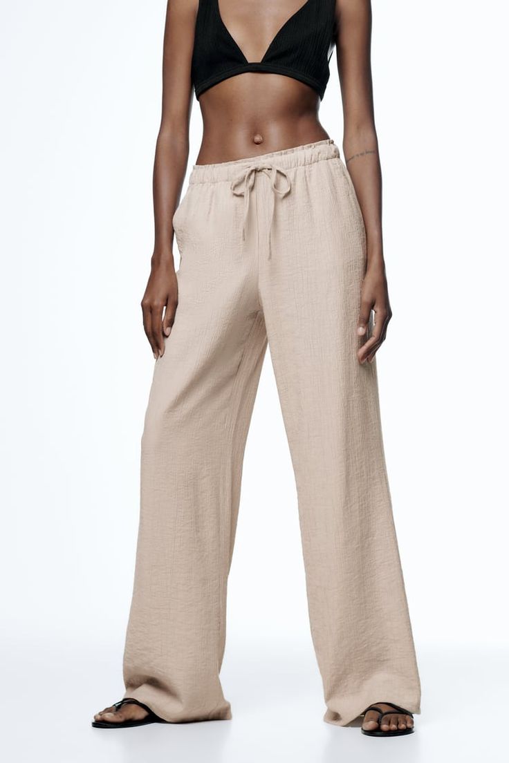 Belted Cuffs Straight Pants, Belted Cuff Trousers, Chic Linen Cargo Pants, Chic Wide Leg Linen Cargo Pants, Straight Pants With Pockets For Daywear, Daywear Straight Pants With Pockets, Daywear Trousers With Side Pockets, Chic Cargo Pants With Belt Loops, Wide Leg Bottoms With Pockets For Daywear