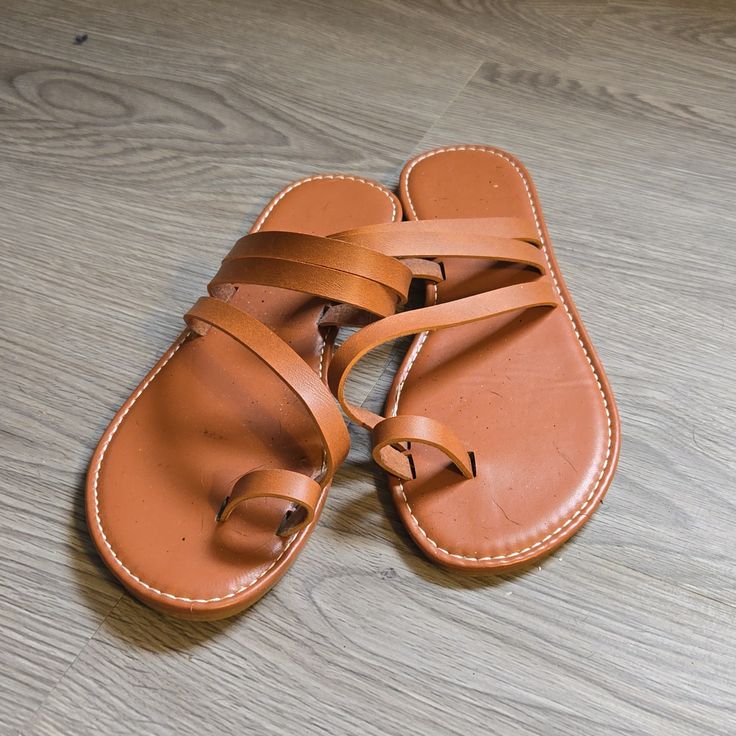 Never Worn Brown Single Toe Strap Flip Flops For Vacation, Brown Toe Loop Flip Flops For Vacation, Brown Flip Flops For Summer Outings, Brown Flip Flops For Spring Summer Outings, Brown Flip Flops For Spring And Summer Outings, Brown Toe Ring Sandals For Spring Beach Outings, Brown Toe Ring Sandals For Beach In Spring, Brown Closed Toe Sandals For Summer, Brown Open Toe Summer Flip Flops