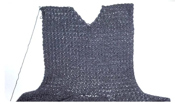 the back of a crocheted vest is shown