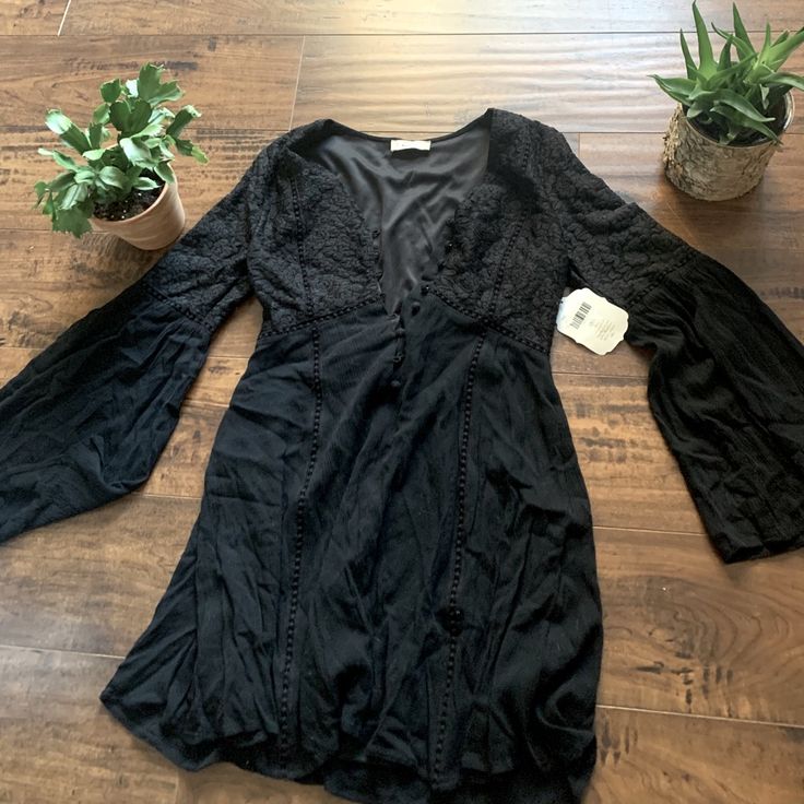 This Is Such A Cute Dress. It Has Witchy Vibes And Would Be So Cute Paired With The Right Boots! Black V-neck Boho Dress For Spring, Fitted Mini Boho Dress For Day Out, Black Long Sleeve Boho Dress For Summer, Black Boho Dress For Spring Vacation, Black Fitted Boho Dress For Spring, Black Mini Dress For Beach In Fall, Casual Black Boho Dress With V-neck, Fitted Black Boho Dress For Spring, Casual Black V-neck Boho Dress