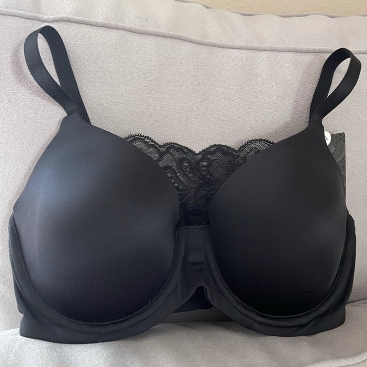 With 5 Different Strap Positions, The Le Mystere Convertible Plunge Bra Is An Ideal Everyday Piece. This Convertible Bra Features A Detachable Lace Panel That Shifts The Silhouette From A Cami Bra To Racerback In Merely Seconds. The Contour Memory Foam T-Shirt Cups Provide An Ultra-Soft Feel That Will Have You Sitting Comfortably All Day. Pair This Plunge Bra With Virtually Any Top In Your Wardrobe! Black Full Coverage Bra With Padded Cups, Black Full Coverage Padded Bra, Black Full Cup Bra With Removable Pads, Black Push-up Bra For Evening, Classic Black Bra With Removable Pads, Classic Black Bra With Padded Cups, Classic Black Underwire Bra, Elegant Evening Stretch Bra, Classic Black Seamless Bra