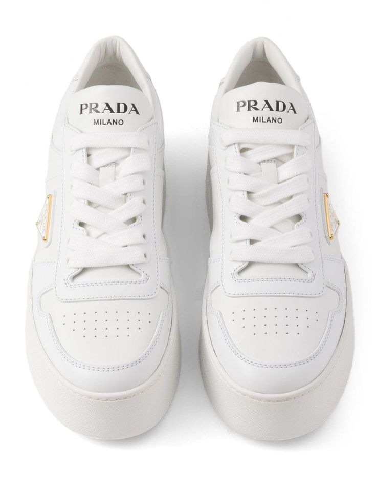 Find PRADA Downtown Bold Leather Sneakers on Editorialist. white leather smooth grain panelled design triangle logo logo-print tongue round toe front lace-up fastening perforated toebox branded heel counter branded leather insole platform sole Lace-up Sneakers With Embossed Logo In Calf Leather, Lace-up Calf Leather Sneakers With Embossed Logo, White Lace-up Sneakers With Logo Detail, White Low-top Platform Sneakers With Logo Detail, Luxury Low-top Sneakers With Logo, White Calf Leather Sneakers With Embossed Logo, Luxury Lace-up Sneakers With Logo Detail, White Calf Leather Sneakers For Streetwear, Luxury White High-top Sneakers With Embossed Logo