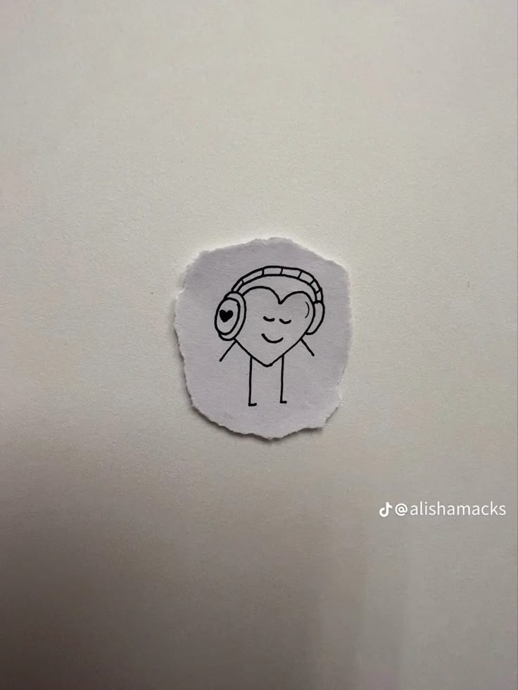 a sticker with a drawing of a person wearing headphones on it's side