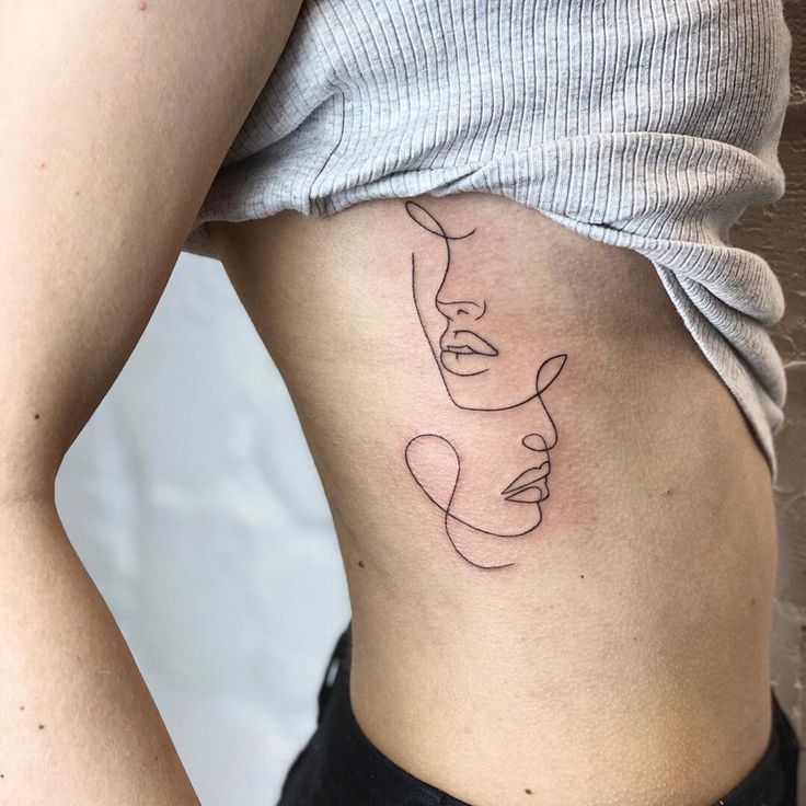 a woman's stomach with a line drawing on the side of her lower back