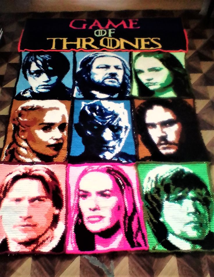 the game of thrones poster is displayed on a table