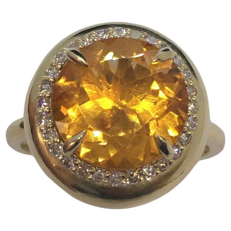 14K Yellow Gold Citrine 1/4 Carat Total Weight Red Diamond Bombe’ Ring Size 10 12mm round citrine 5.5 Carat weight 28 pieces of 1.3 mm round natural Rose Color Diamond 1/4 Carat total diamond weight 8.4 gram Size 10 3/4 inch in diameter on topside Bombe’ style Bombe Ring, Red Diamond, Domed Ring, Size 10 Rings, Rose Color, Color Rosa, Colored Diamonds, Citrine, Jewelry Rings