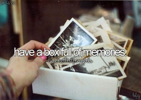 someone holding up some pictures with the caption have a box full of memories