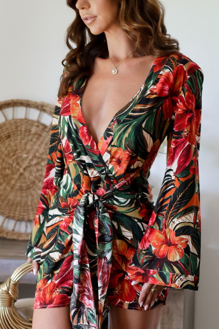 Get ready for summer fun with our Camila Floral Dress Perfect for a date night, this romper is sure to turn heads. 85% Linen 15% Linen Color: Multi Tropical Floral Print Deep V Dress Long Bell Sleeve Front Drape Tie Wrap Front Bust Clasp & string Loop Closure (see image) No Button/Zipper Closure Light Weight True to Size Model is wearing a size Small. She is 5'6". 135lbs. Bust: 34C Waist 26" Hips 36" V Dress, Deep V Dress, Get Ready For Summer, Linen Color, Tie Wrap, Tropical Floral Print, Floral Romper, Tropical Floral, Dress Long