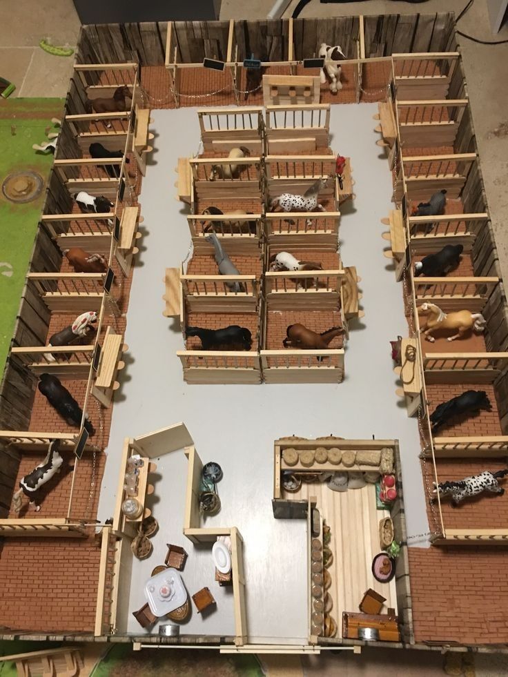 an overhead view of several wooden crates with animals in them