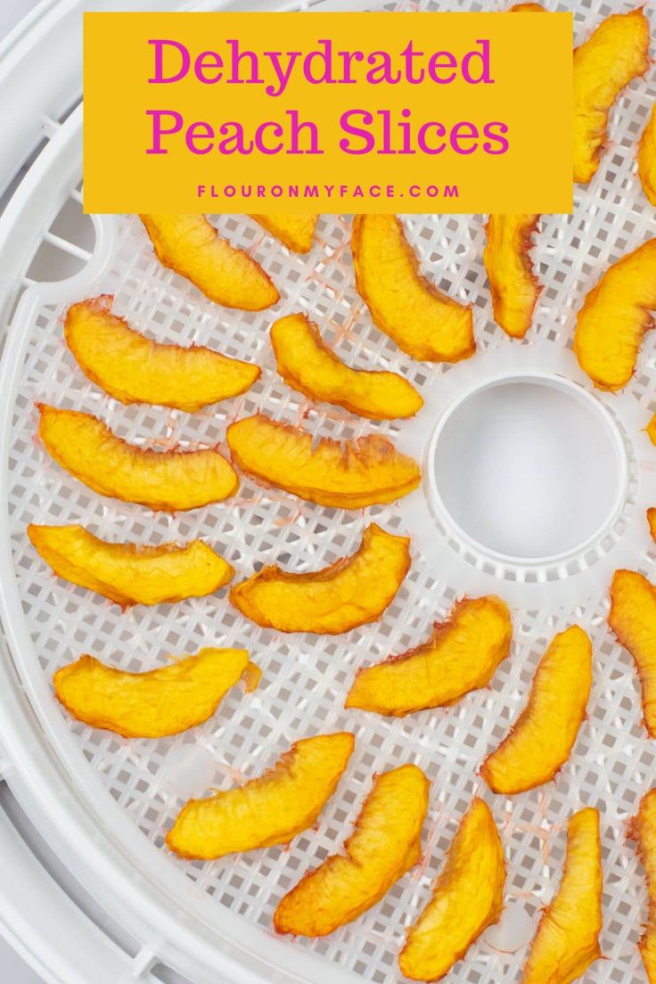 peeled peach slices sitting on top of a white mesh tray with the words, dehydrated peach slices