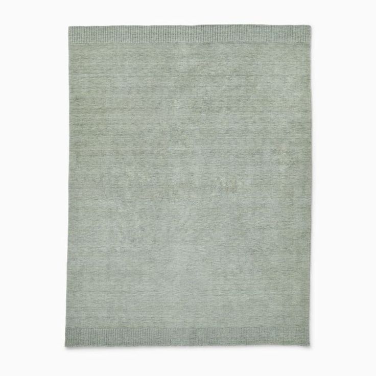 a light green rug on a white background with no one in it or someone else