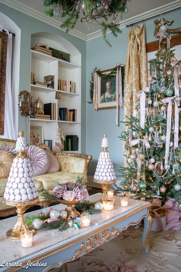 a living room decorated for christmas with candles and ornaments on the table in front of it