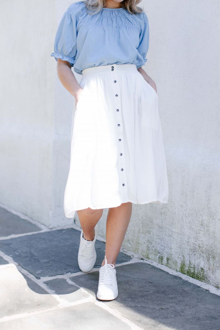 Feminine meets practical in this sweet button-down skirt featuring pockets and a softly gathered waist. An attached slip means no layering required! The Skye Skirt is an easy pick for your next coffee date, photoshoot, or weekend outing! Available in Taupe, Black, White and Navy. Lining: 100% Polyester Hand Wash Cold Separately; Hang to Dry Elastic Back Waistband Fully-Lined All conversions are approximate. Fits may vary by style or personal preference Please carefully measure yourself before pl Button-up Lined Skirt For Day Out, Spring Relaxed Skirt With Button Closure, Casual Daywear Midi Skirt, Casual Midi Skirt For Daywear, Summer Button-up Lined Skirt, Modest Bottoms For Day Out, Modest Midi Skirt For Day Out, Button-up Relaxed Skirt For Spring, Button Closure Midi Skirt For Daywear