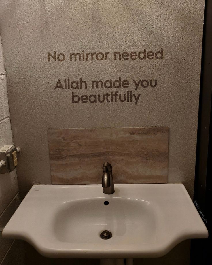 a bathroom sink with a sign above it that says no mirror needed aliah made you beautifully