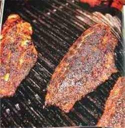 three steaks are cooking on the grill and being grilled for lunch or dinner