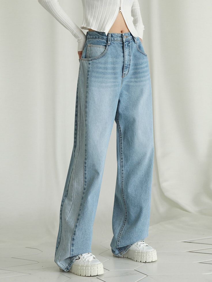 Editor's NotesCut from 100%cotton denim fabric, these jeans feature a wide silhouette in long length. Theyhave two-toned color details on the sideline. Recommend creating various styling by matching them with top clothes.     - Wide-fit denimpants- Two-toned color details - Double closureof button and zipper- Front and backpocket details Measurements (in.)Size (XS / S / M / L / XL)- Length: 43.3 in. / 44.09 in. / 44.48 in. / 45.27 in. / 45.86 in.- Waist: 13.78 in. / 14.56 in. / 15.15 in. / 16.53 in. / 17.71 in.- Hip: 19.29 in. / 20.07 in. / 20.86 in. / 21.65 in. / 22.63 in.- Rise: 12.2 in. /  12.99 in. / 13.38 in. / 13.77 in. / 14.17 in.- Thigh: 11 in. /  11.8 in. / 12.4 in. / 12.79 in. / 13.38 in.- Hem: 8.66 in /  9.25 in. / 9.64 in. / 10.23 in Top Clothes, Wide Pants, Denim Fabric, Long Length, Front Zipper, Two Tone, Light Blue, Top Outfits, Pants