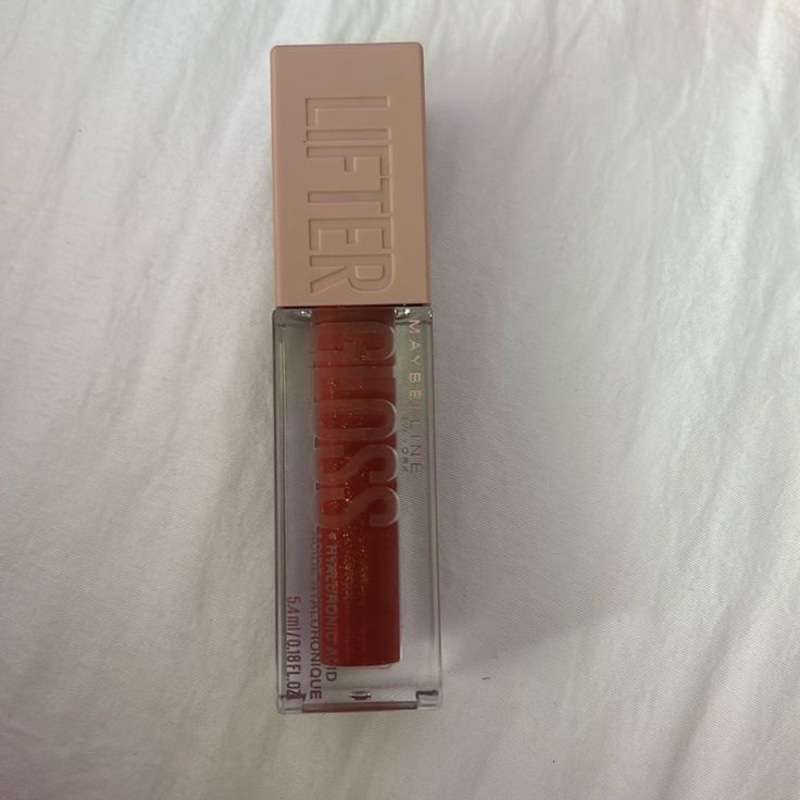 In The Color 016 Rust Maybelline Lifter Gloss Bronze, Maybelline Lifter Gloss Rust, Maybelline Touch Of Spice, Maybelline Gloss, Maybelline Makeup Products, Maybelline Lip Gloss, Maybelline Vivid Matte Liquid, Maybelline Lifter Gloss, Maybelline Colossal