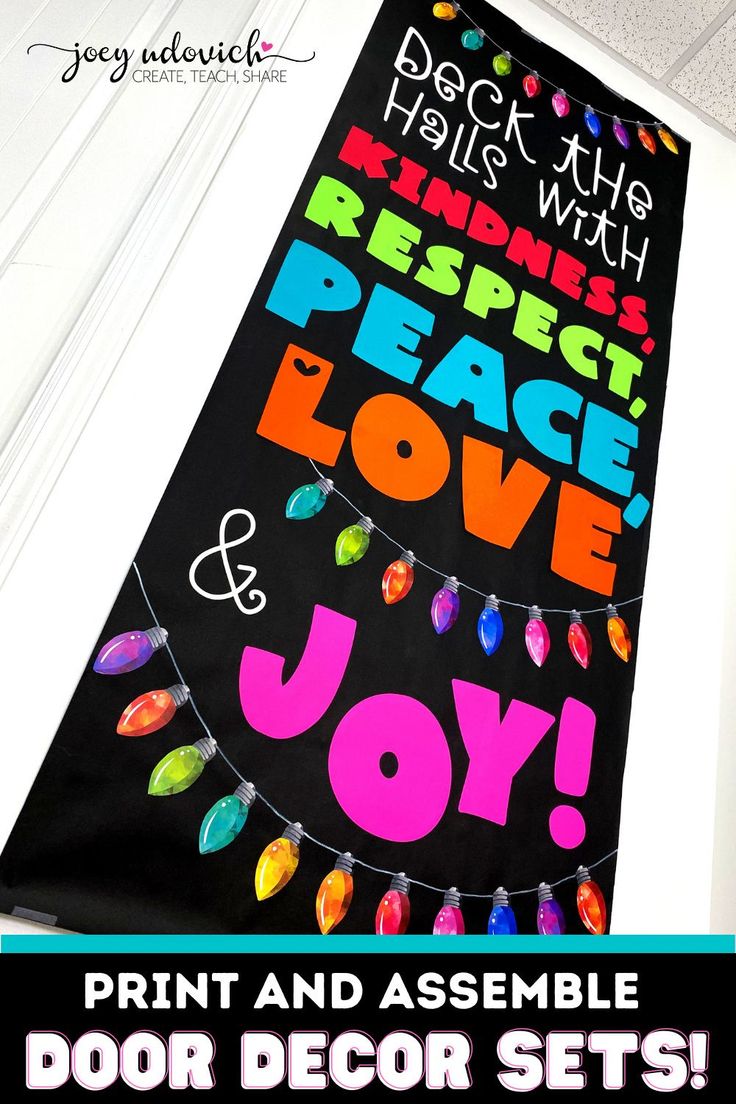 the door is decorated with colorful christmas lights and sayings for peace, love, and joy