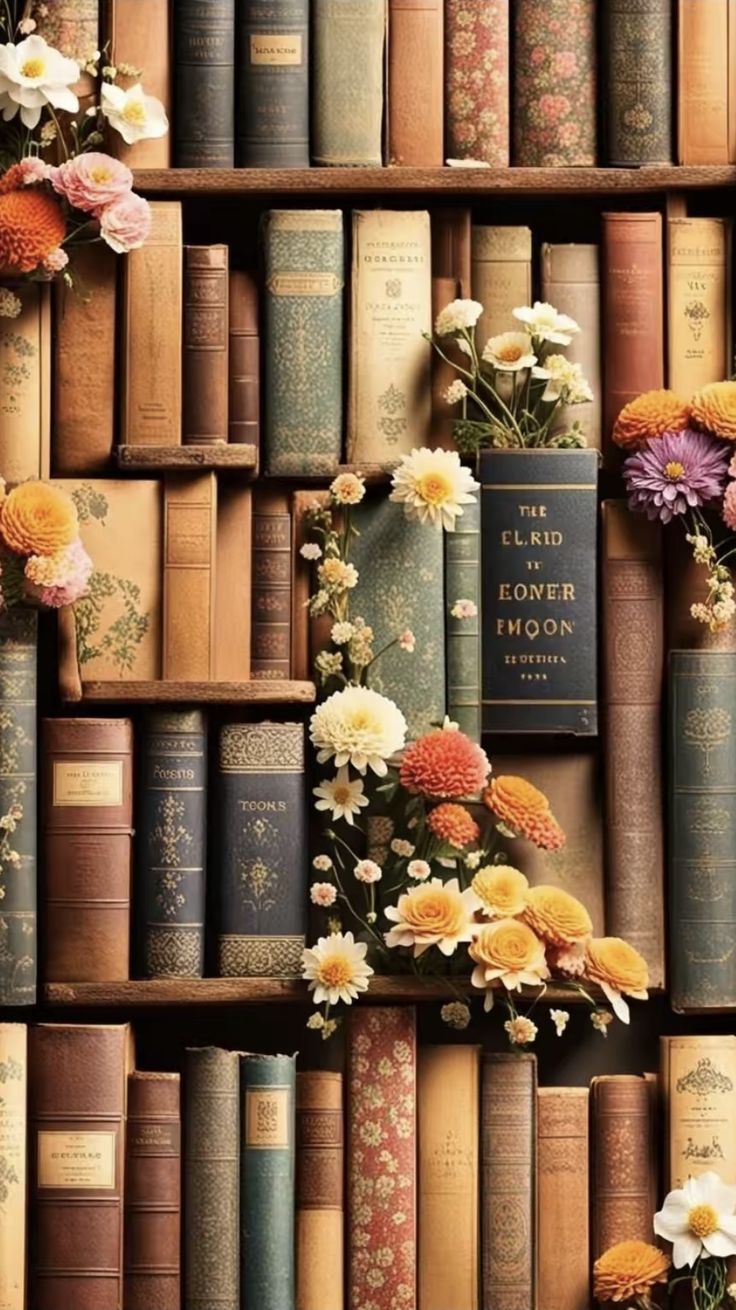 a book shelf filled with lots of books covered in different types of flowers next to each other