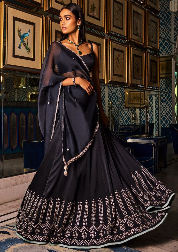 Black satin lehenga with organza dupatta. Lehenga is embroidered with small pearls and zardosi work. Black Satin Lehenga, Dolly J, Embroidery Zardozi, Satin Lehenga, Drape Sarees, Placement Embroidery, Zardosi Work, Cocktail Gowns, Sharara Set