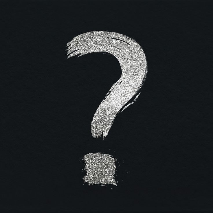 a black and white photo with a question mark in the middle, on a dark background