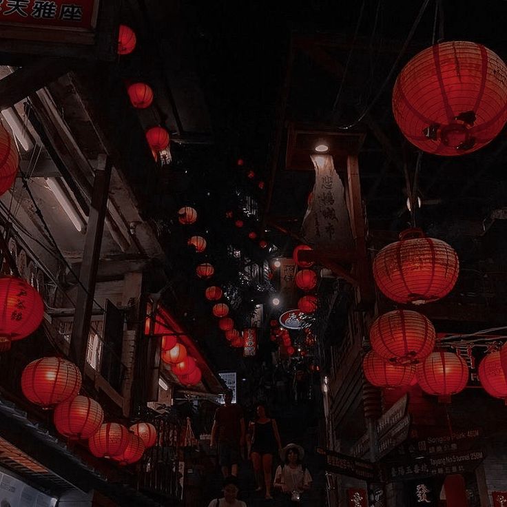 many red lanterns are hanging from the ceiling