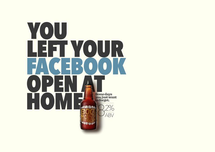 a bottle of beer sitting on top of a white table next to a sign that says you left your facebook open at home