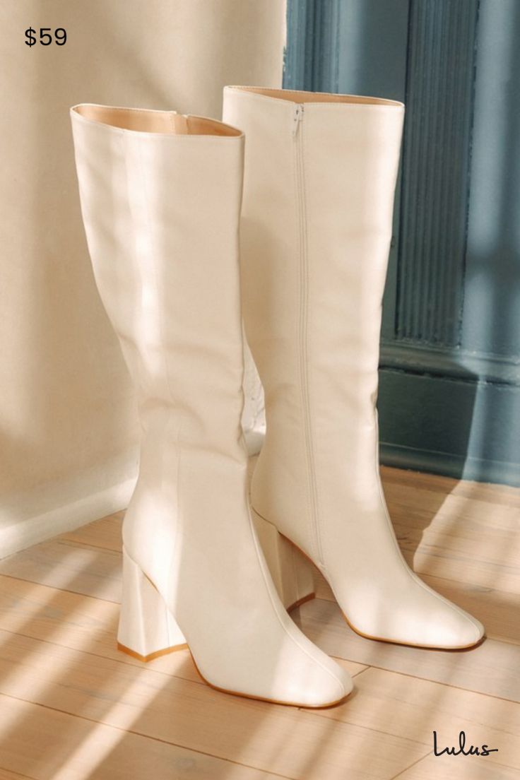 We have a feeling the Lulus Magnolia White Square Toe Knee-High Boots are going to complete all of your go-to looks this season! Smooth faux leather shapes these flirty boots that have a square toe upper and a 14.75"" knee-high shaft with a decorative seam-inspired detail at the outstep and a 15.5"" circumference. A 15.5 zipper at the instep makes for easy styling, while a trendy block heel completes the stylish look! 3. 75" wrapped block heel. Cushioned insole. Rubber sole has nonskid markings. Man made materials. Imported. Lulus | Magnolia White Square Toe Knee-High High Heel Boots. Tall White Cowgirl Boots, White Boots Aesthetic, Knee High White Boots, White Knee High Boots Outfit, Daphne Halloween, Tall White Boots, White Go Go Boots, White High Boots, 2025 Outfit