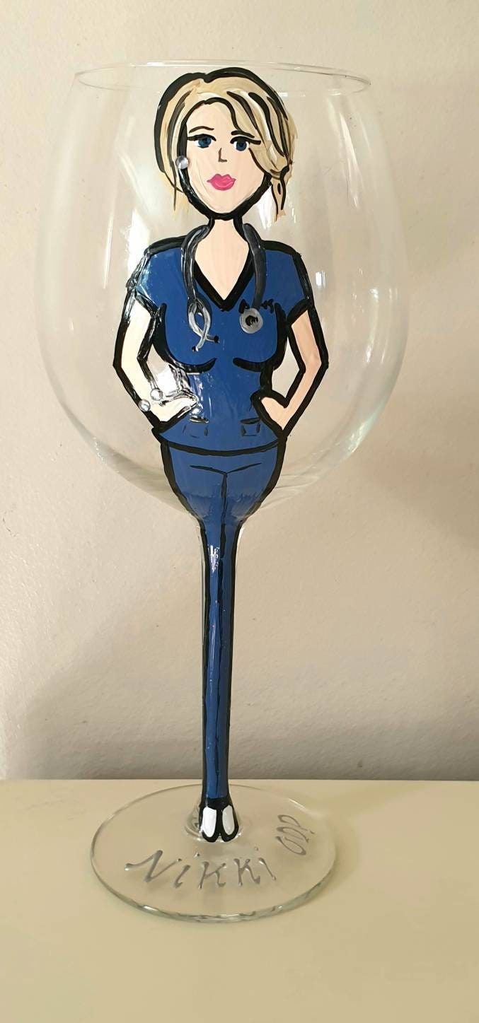 a wine glass with a drawing of a woman in scrubs on it