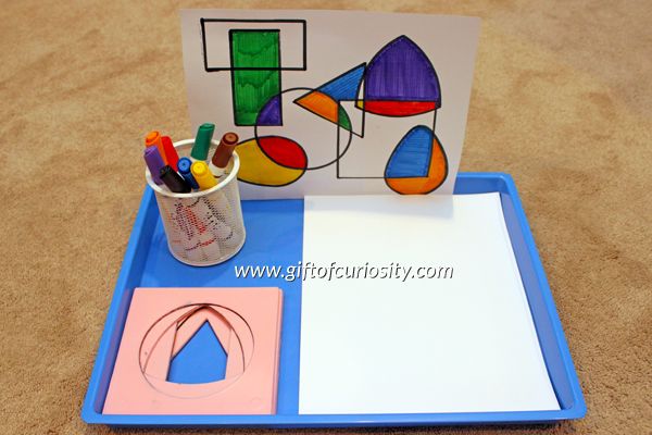 a tray that has some paper and markers on it