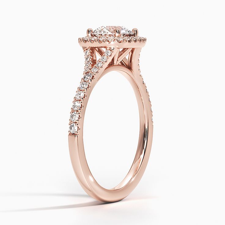 Lab Grown Joy Half-Coverage Lab Diamond Engagement Ring - 14K Rose Gold. A glittering softened halo of diamonds surrounds the center gem in this elegant setting. A scalloped pavé split-shank band adds a stylish, dazzling effect. Rose Gold Cushion Engagement Ring, Luxury 14k Rose Gold Halo Setting Rings, Luxury 14k Rose Gold Rings With Halo Setting, Classic Rose Gold Diamond Ring With Pave Setting, Classic Rose Gold Wedding Rings With Pave Setting, Rose Gold Halo Setting Round Wedding Ring, Luxury Cluster Ring With Center Stone In Rose Gold, Luxury Rose Gold Cluster Ring With Center Stone, Elegant 14k Rose Gold Jewelry With Halo Setting